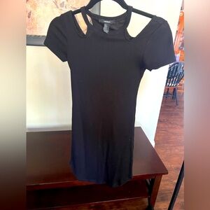 Forever 21 black bodycon dress with shoulder detail. Size small.